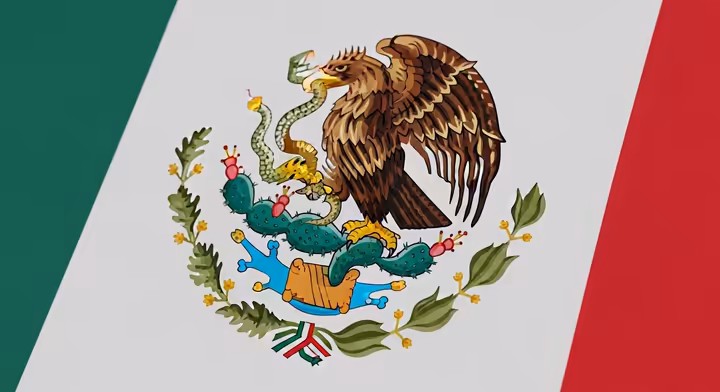 The central emblem of the Mexican flag, showing an eagle on a cactus devouring a snake, derived from the myth of Tenochtitlan's founding.